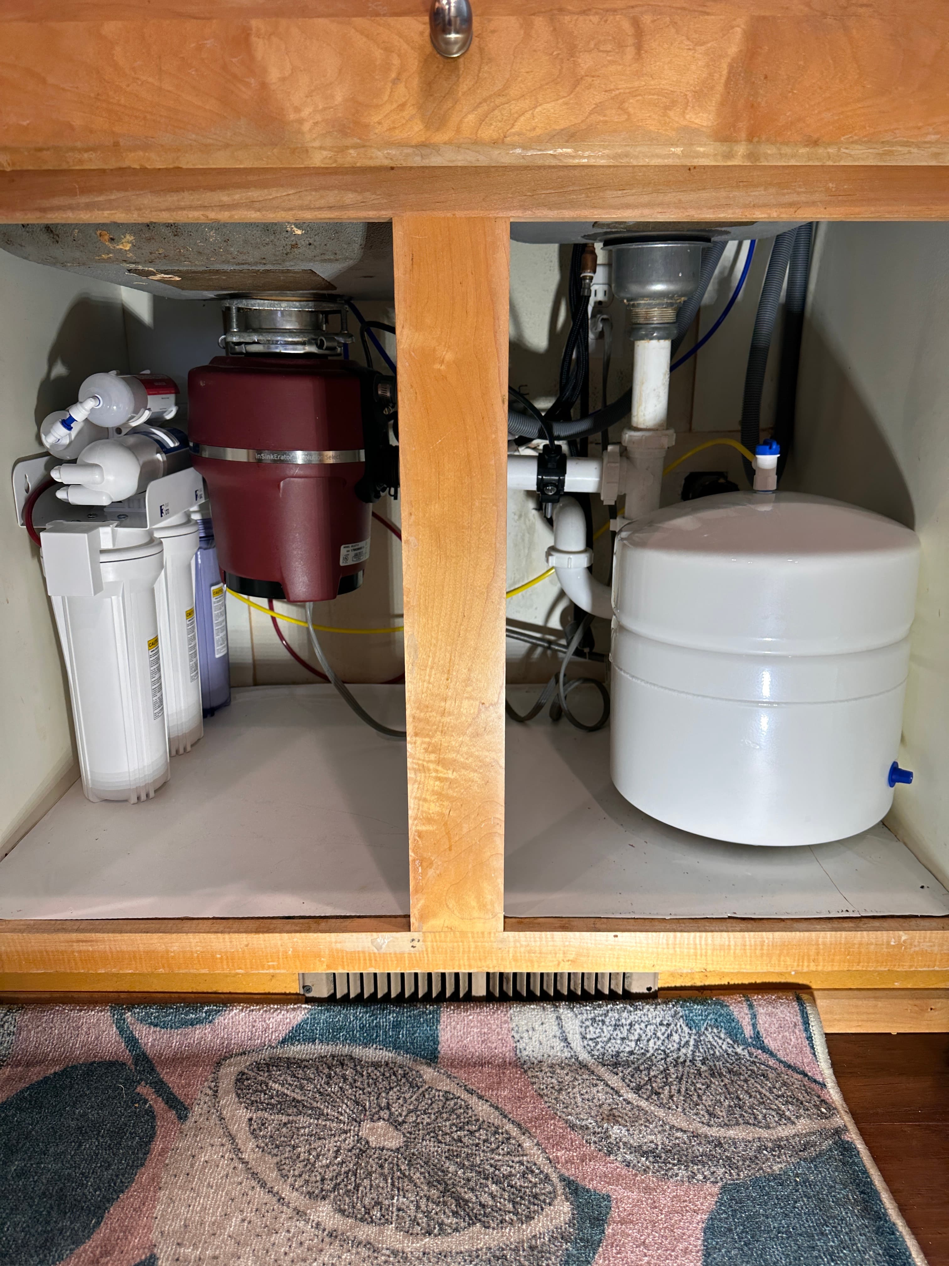 Premium drinking water pouring from a dedicated RO faucet at a Tustin home