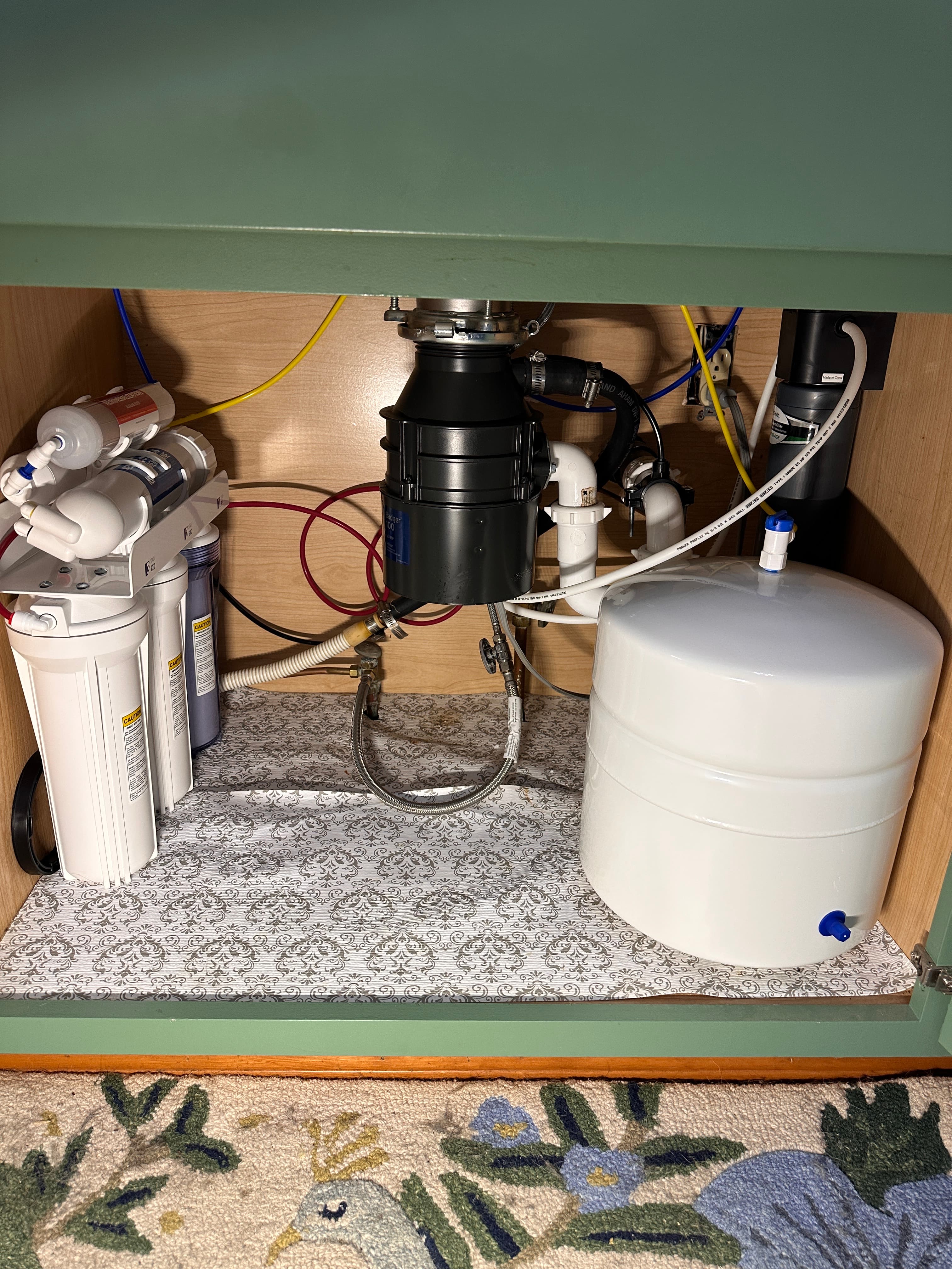 Five-stage reverse osmosis system installed under a Newport Beach kitchen sink
