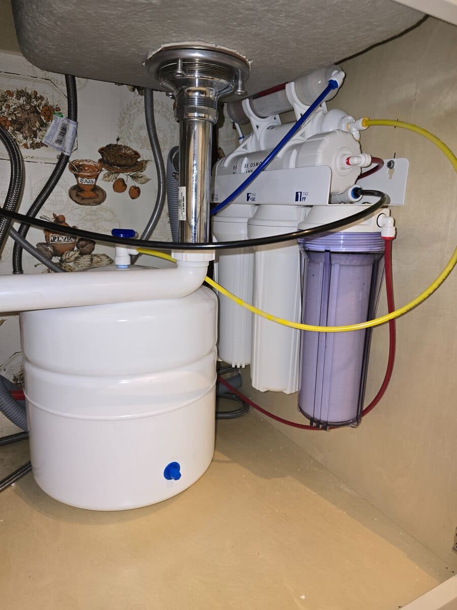 Reverse osmosis system tucked cleanly under a Fullerton kitchen sink