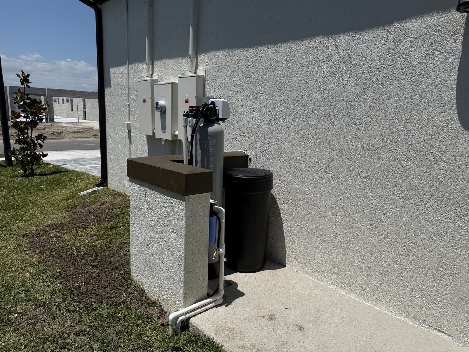 Outdoor filtration tanks installed at the service line of a Redlands home