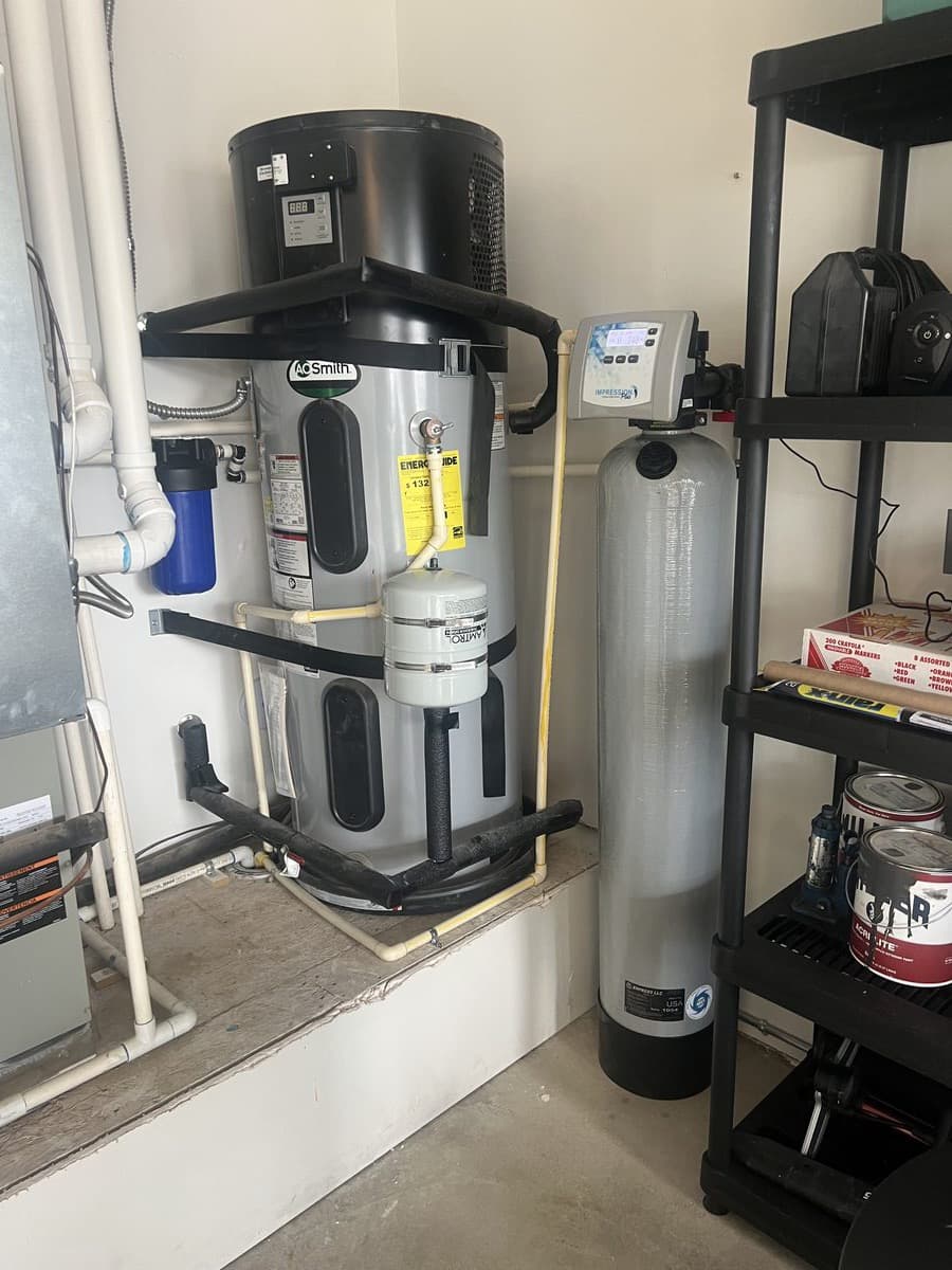 Hybrid hot-water heater installed alongside softener in a Pasadena garage