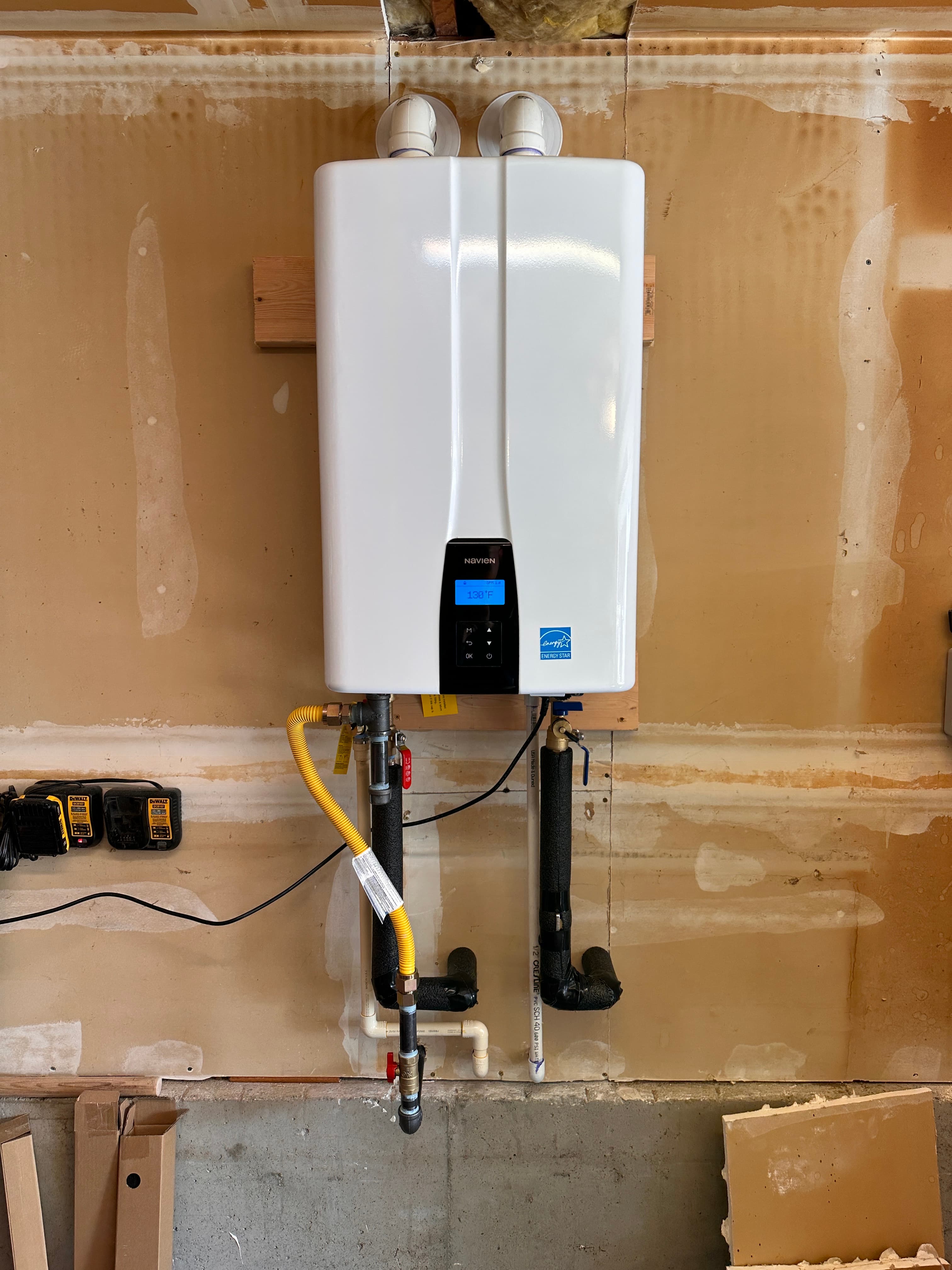 New tankless water heater installed alongside a whole-home softener in a Costa Mesa home