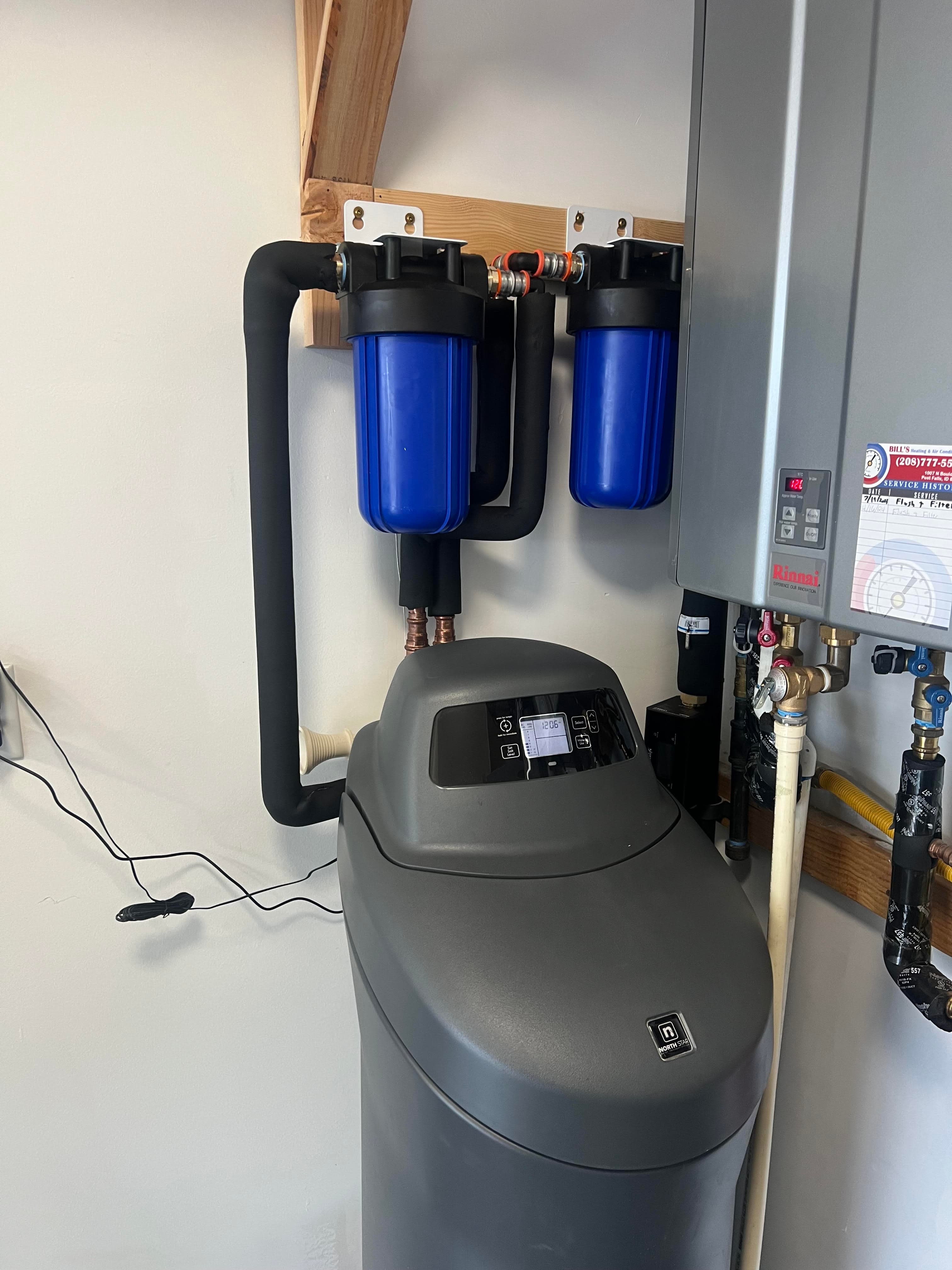 Cabinet-style softener tucked into a laundry room at a SoCal home