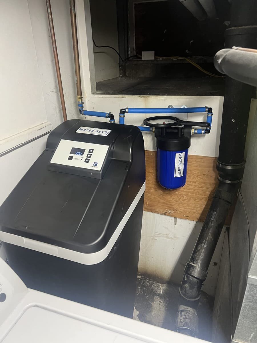 Cabinet-style softener installed in a limited-space Santa Ana laundry room