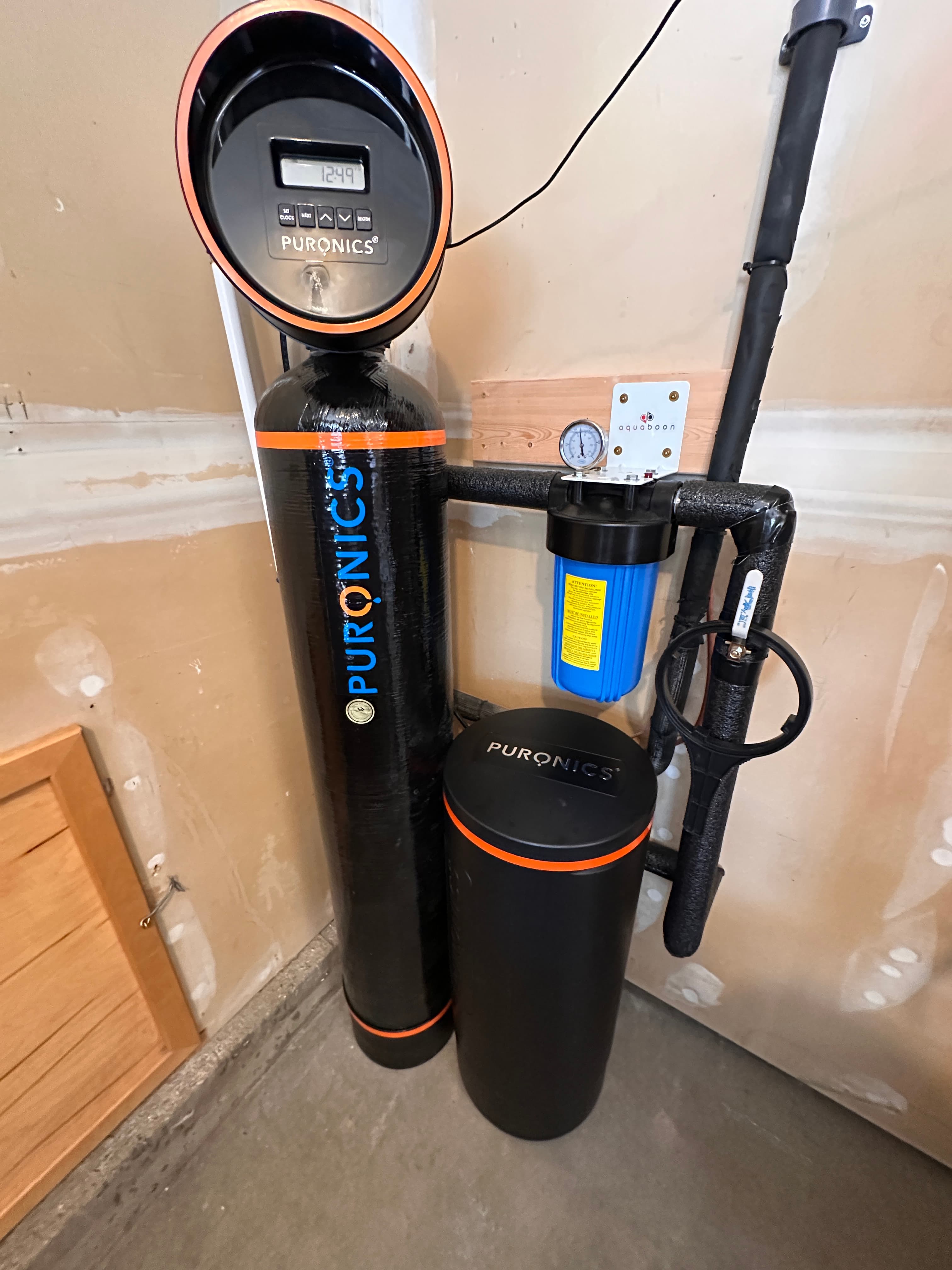Whole-home Puronics filtration system installed on the main line in an Anaheim garage