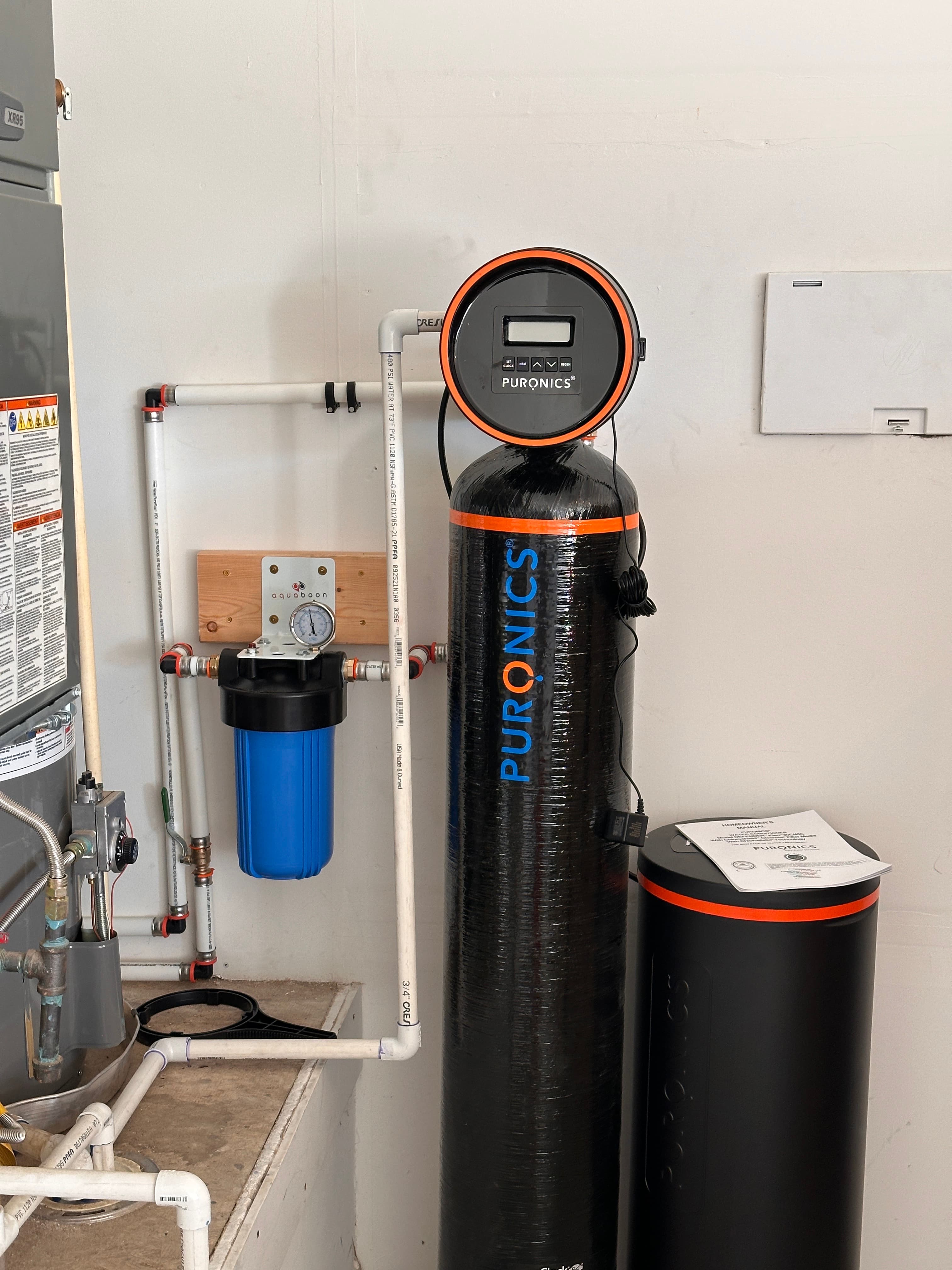 Puronics whole-house filtration stack on the main line