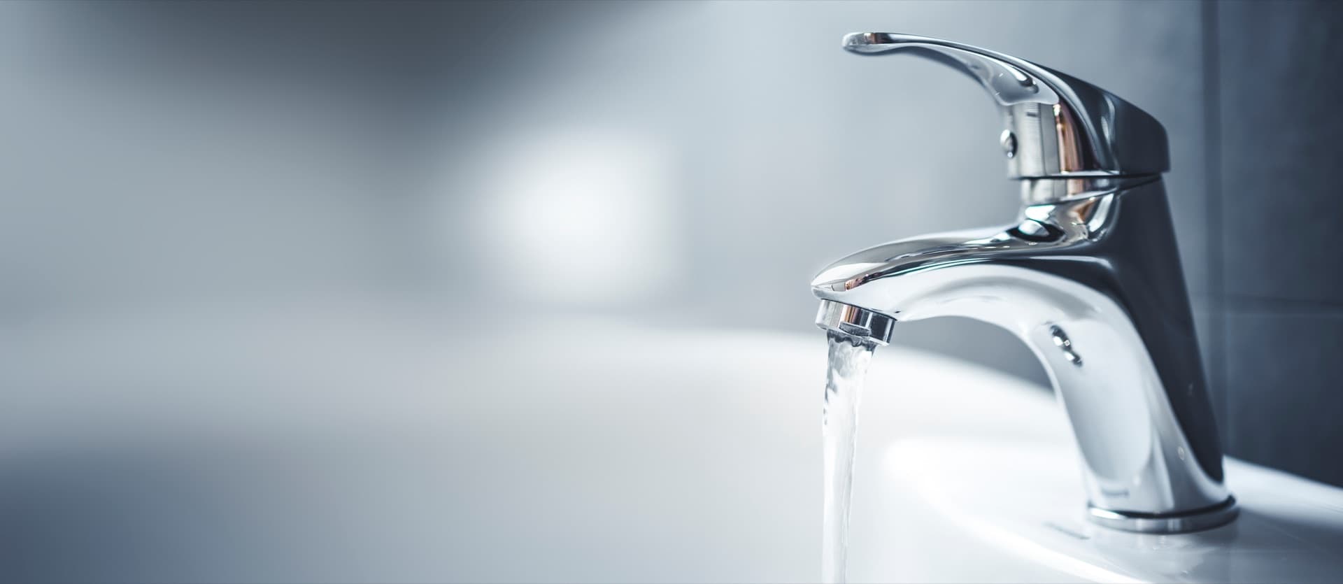 Filtered water flowing from a household faucet