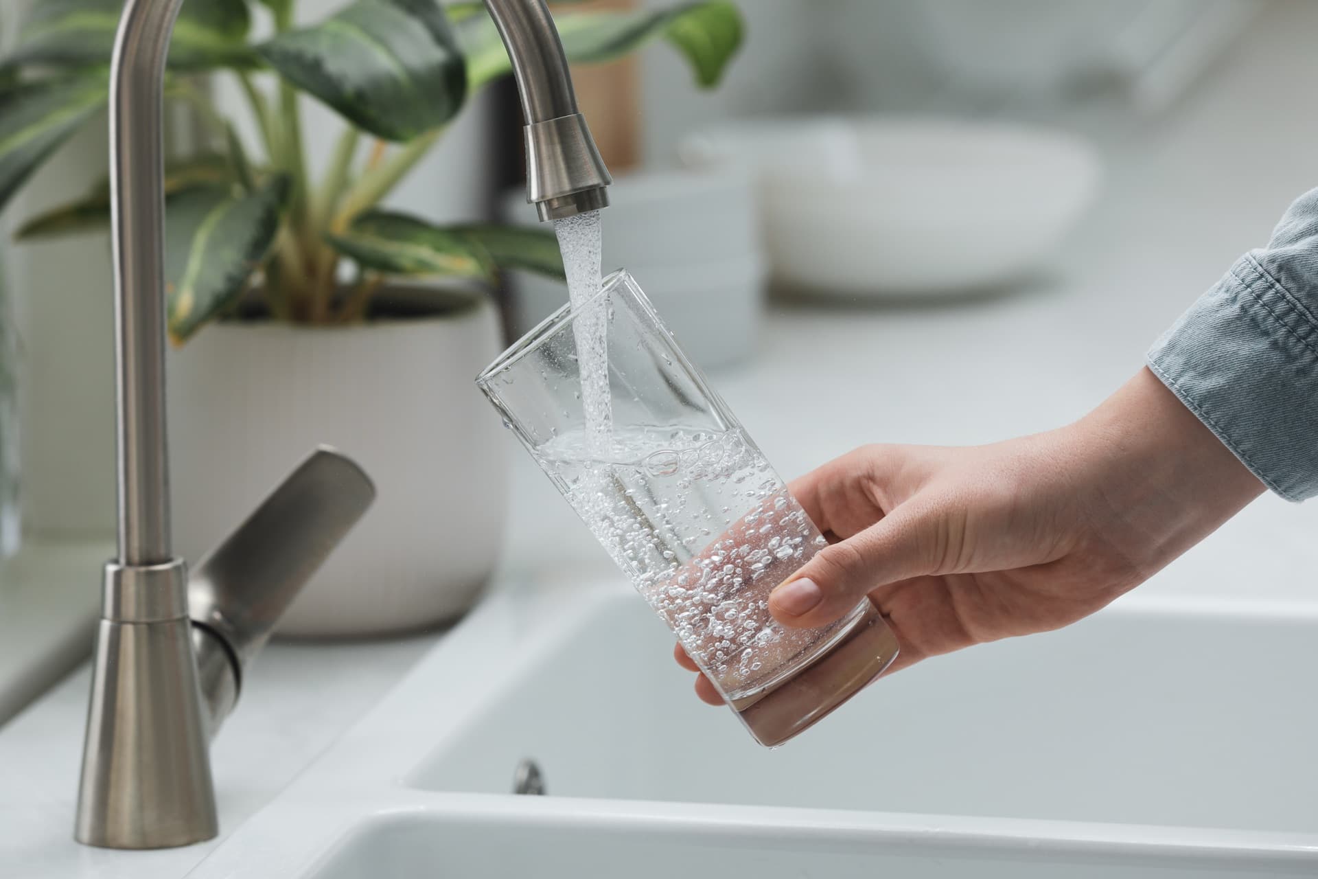 Filling a glass of tap water in Southern California, where nitrate from agricultural runoff affects many groundwater basins
